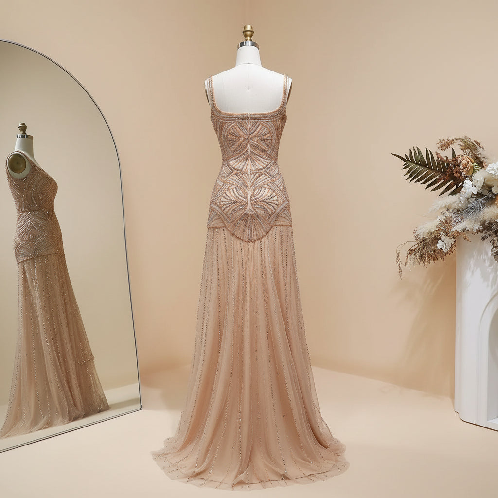 Stunning luxury Beige evening gown on a mannequin with floral decorations in the background