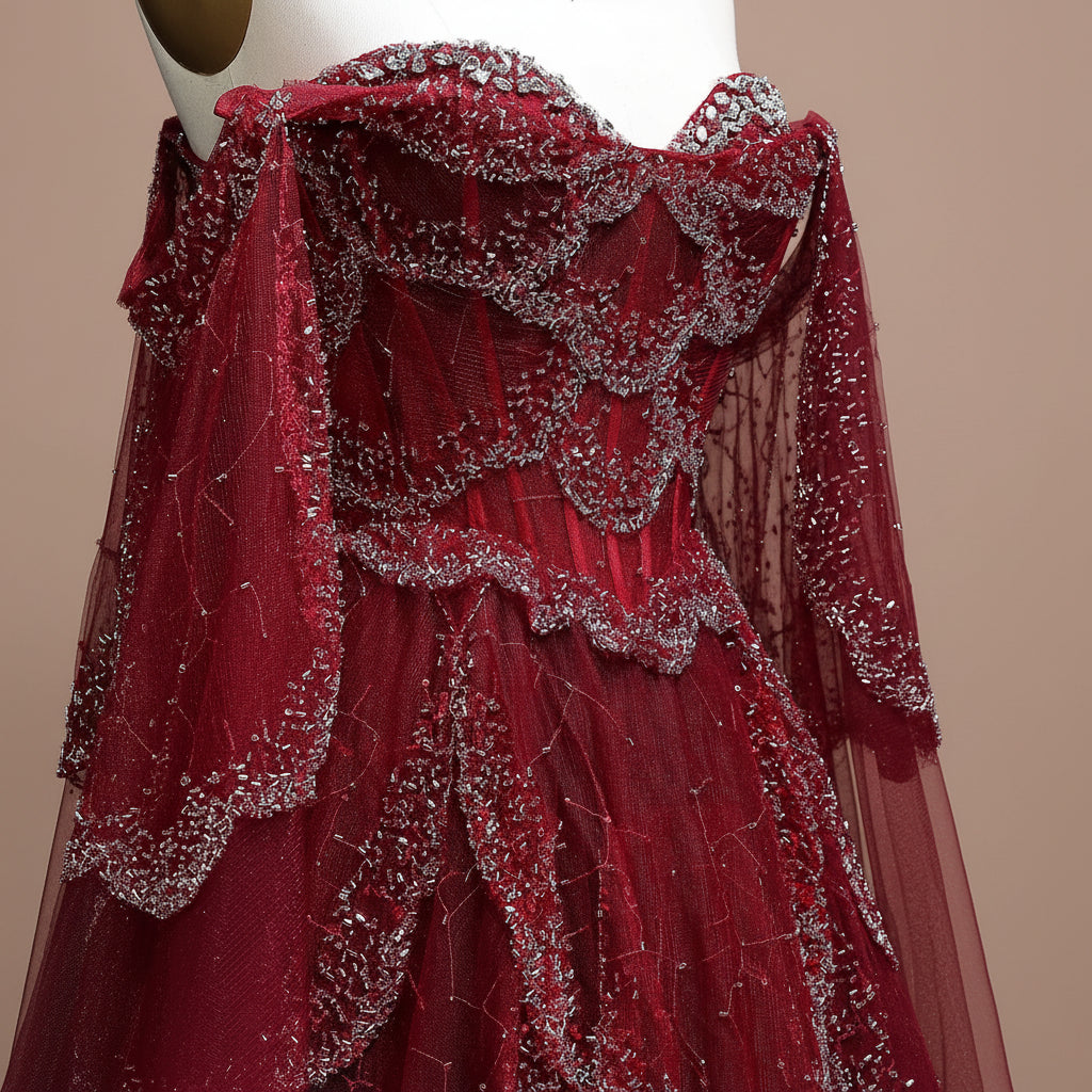 Couture inspired Red dress with silver embellishments on a mannequin against a light background