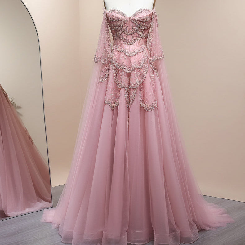 Amazing Pink princess-like ballgown on a mannequin against a light background