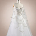 Luxury fashion White wedding dress with stunning intricate silver detailing on a mannequin against a light background