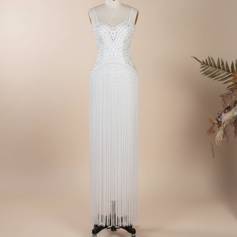 Stunning White crystal beaded high fashion evening gown on a mannequin with a neutral background