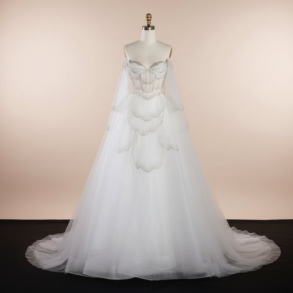 White couture inspired wedding dress with intricate sparkling detailing on a mannequin against a black background