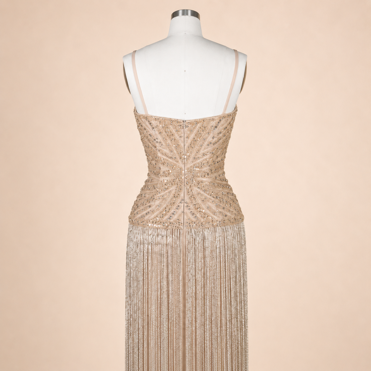 Sparkling Champagne luxury evening gown on a mannequin against a beige background