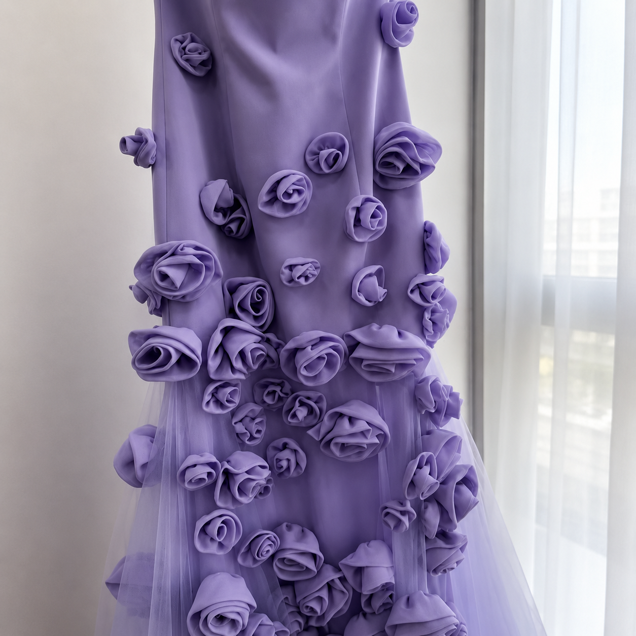 Purple luxury prom dress with floral embellishments against a neutral background