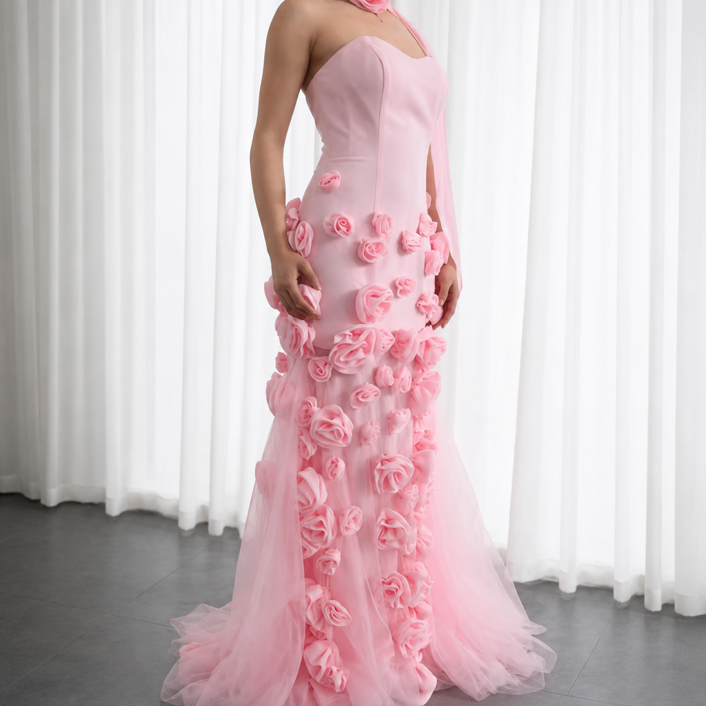 Eclectic couture fashion Pink evening gown with rose flower details against a white curtain background
