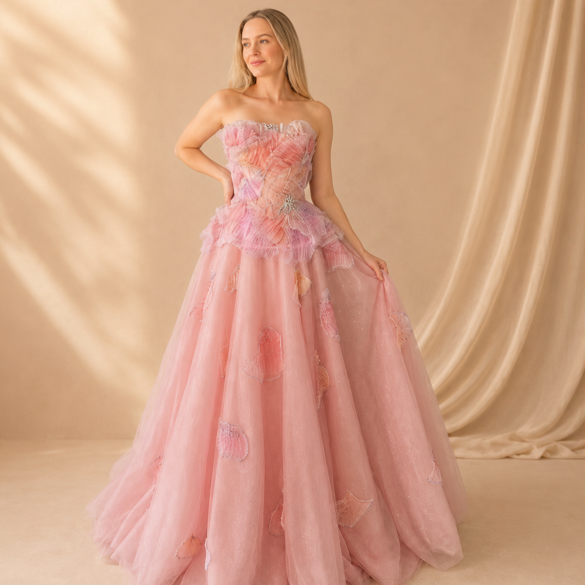Beautiful lady wearing a fantasy like luxury pink ballgown with three dimensional embellishments and shimmering intricate beadwork details
