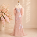 A gorgeous pink evening gown on a mannequin, covered in luxury crystal, pearl and sequin embellishments in stylish intricate patterns. The dress is on a mannequin in a warmly lit dressingroom with flattering pink flowers in the background 